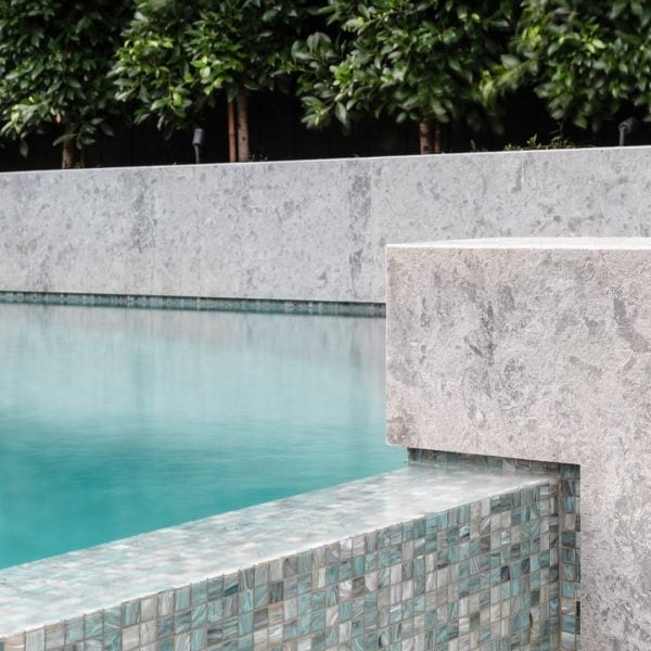 Pool tiles surrounding a Feature Pools concrete swimming pool build