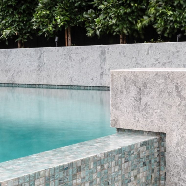 Pool tiles surrounding a Feature Pools concrete swimming pool build